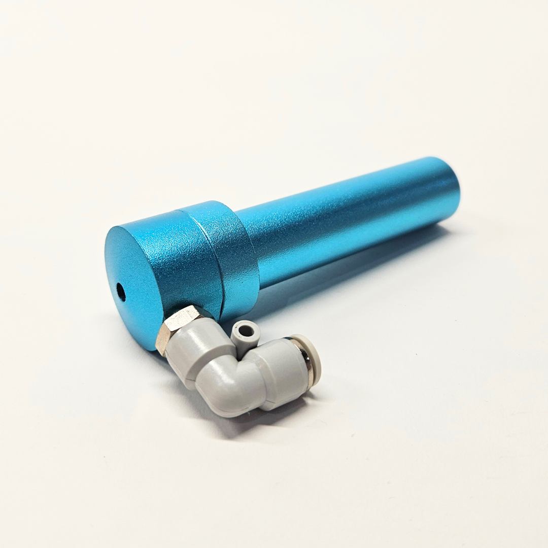 a blue metal tube with a small hole in the end